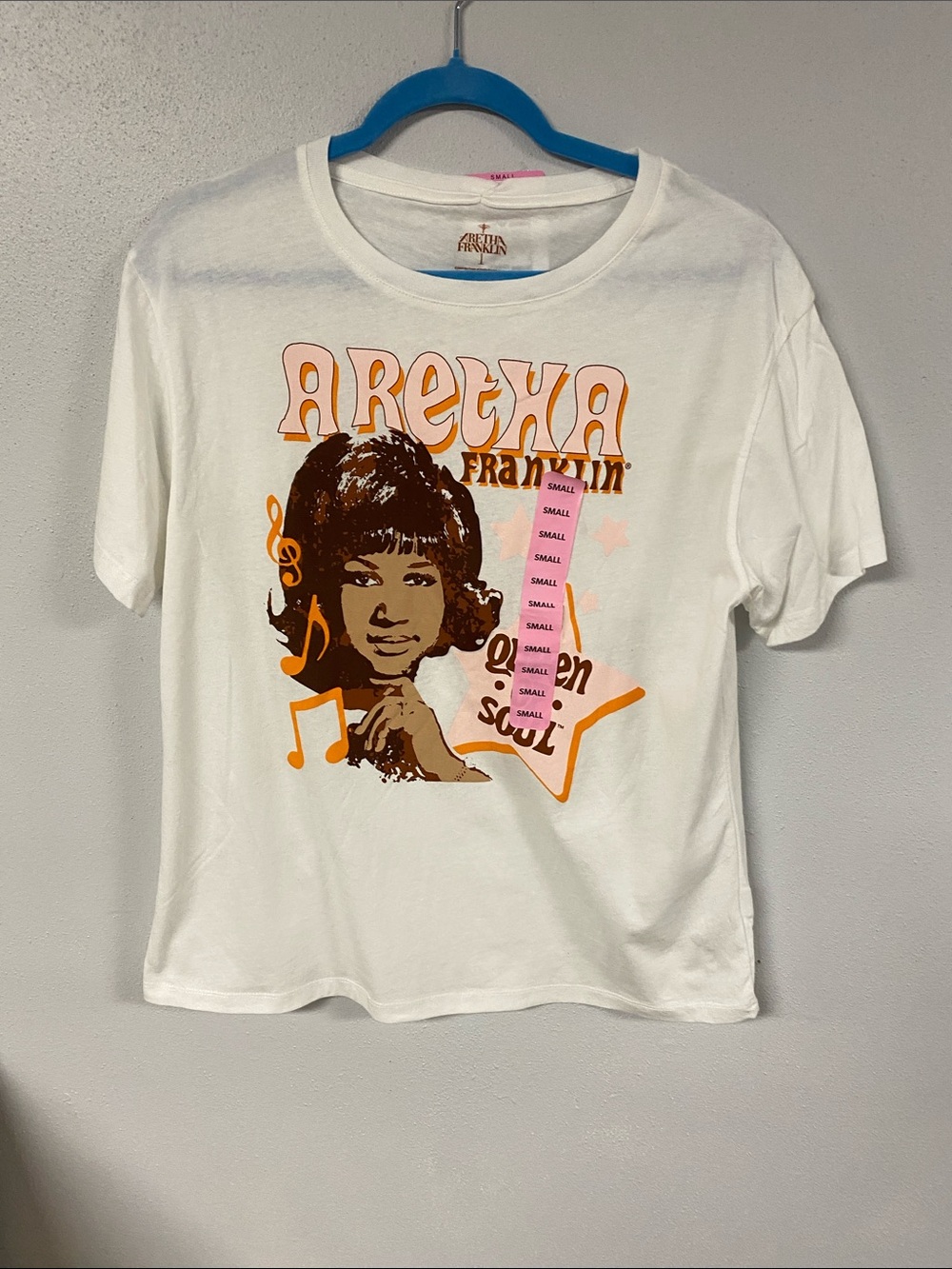 Aretha Franklin Graphic Tee - White with Orange & Brown Print. Size S